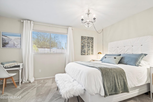 bedroom with baseboards, carpet flooring, and an inviting chandelier