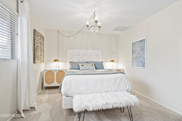 carpeted bedroom featuring an inviting chandelier, visible vents, and baseboards