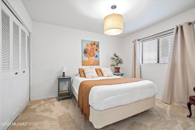 bedroom with a closet and carpet flooring