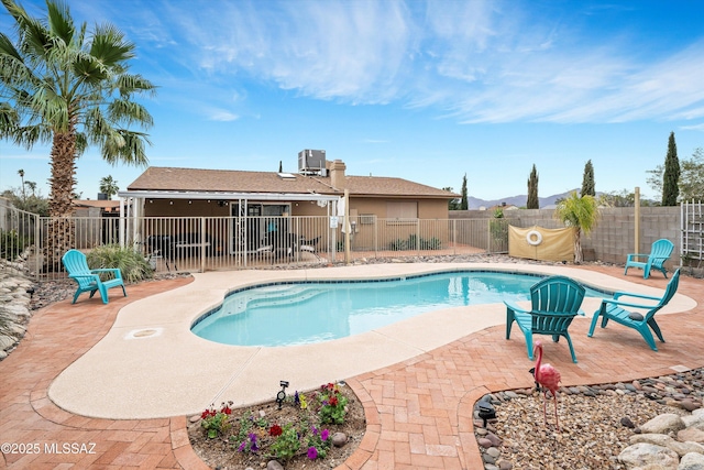 view of pool with a patio area, a fenced backyard, and a fenced in pool