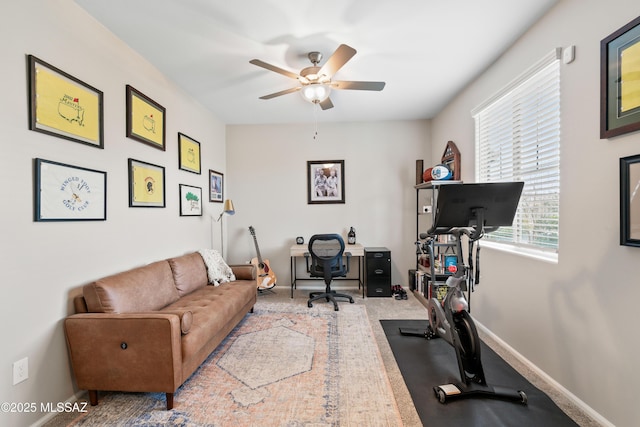 home office with carpet, ceiling fan, and baseboards