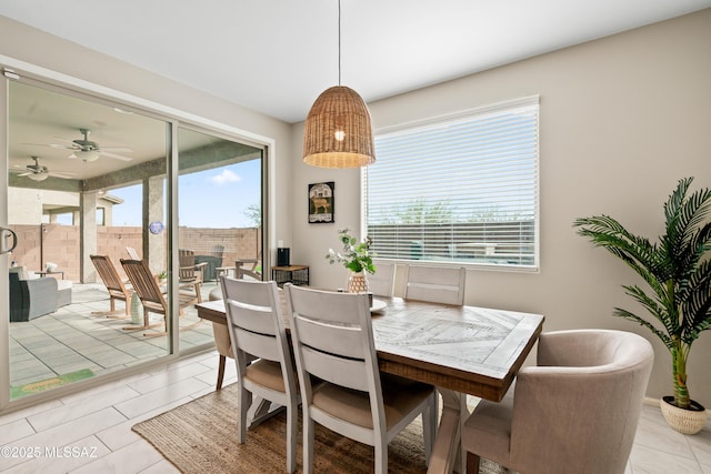 dining space with plenty of natural light and light tile patterned floors