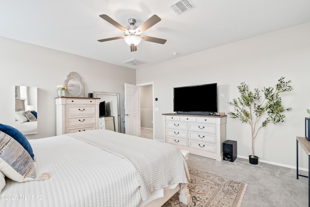 bedroom with light carpet, ceiling fan, visible vents, and baseboards