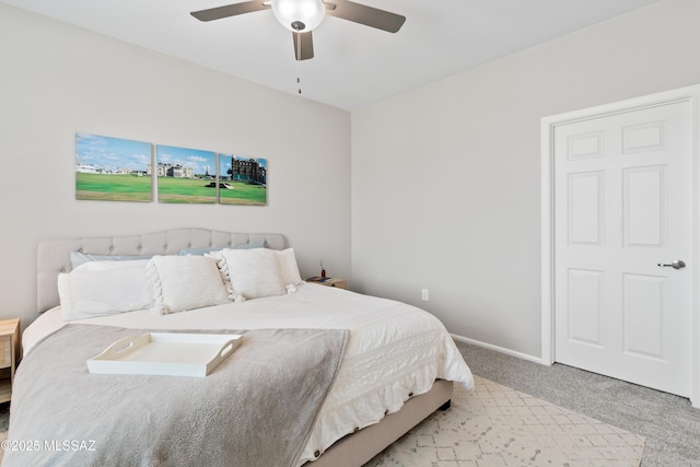 bedroom featuring carpet, baseboards, and ceiling fan