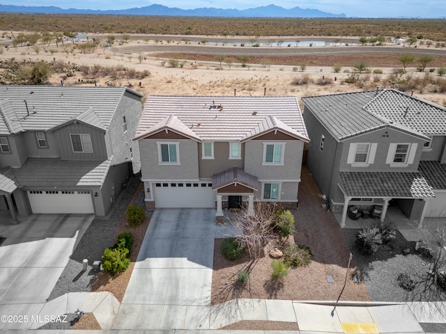 birds eye view of property with a desert view and a mountain view