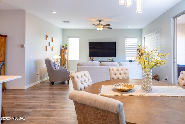 dining area featuring baseboards, visible vents, a ceiling fan, wood finished floors, and recessed lighting