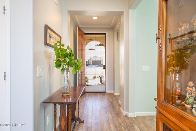 entryway with recessed lighting, baseboards, and wood finished floors