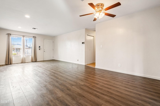 unfurnished living room featuring baseboards, visible vents, ceiling fan, wood finished floors, and recessed lighting