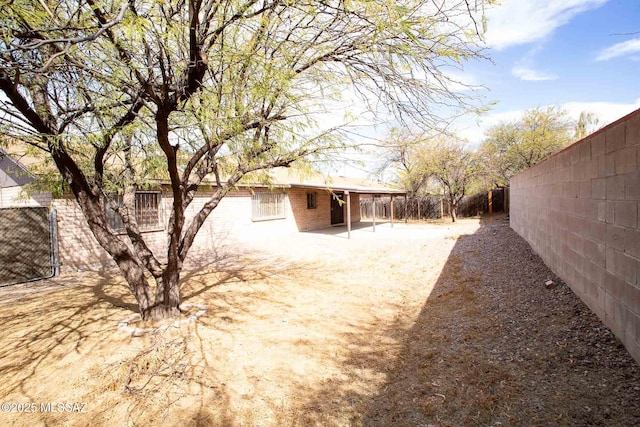 view of yard featuring a fenced backyard and a patio