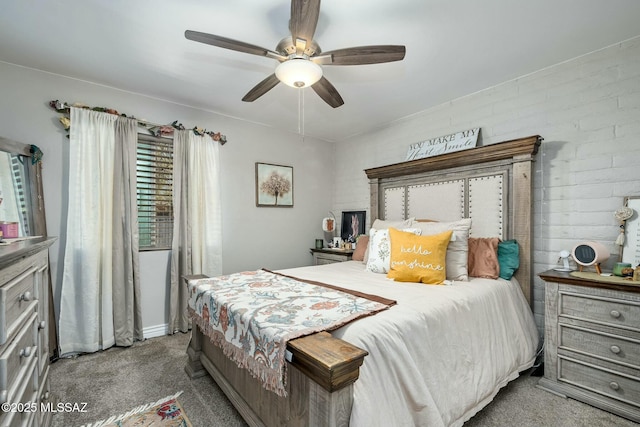 bedroom featuring ceiling fan and carpet