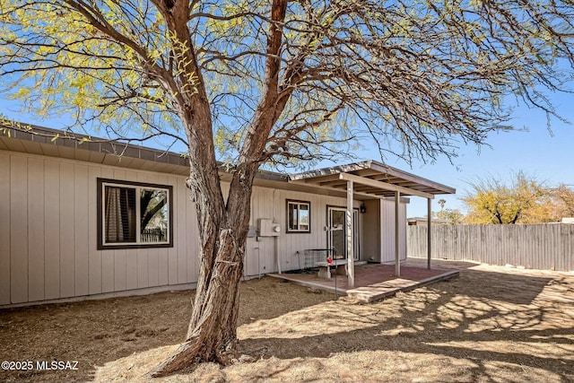 back of property with fence