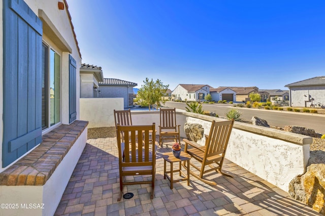 view of patio with a residential view