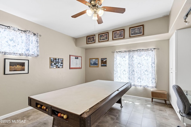 playroom featuring tile patterned floors, a ceiling fan, and baseboards