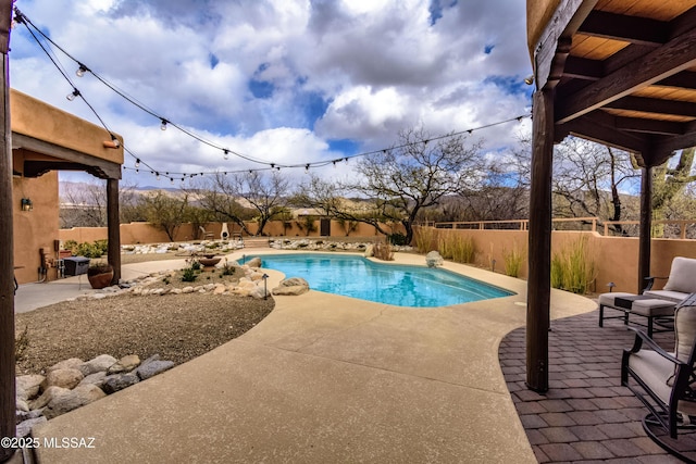 view of pool featuring a fenced backyard, a fenced in pool, and a patio