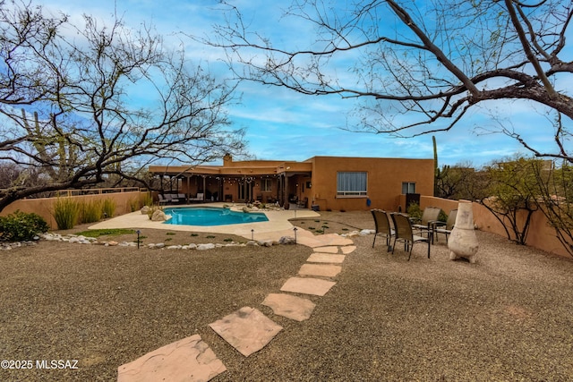 view of swimming pool featuring a fenced in pool and a patio