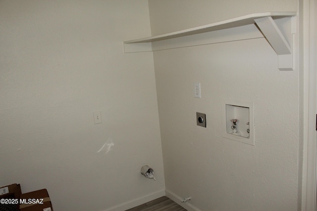 laundry room with hookup for a washing machine, baseboards, dark wood finished floors, laundry area, and electric dryer hookup