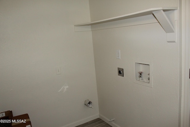 laundry area with baseboards, washer hookup, laundry area, dark wood-style floors, and electric dryer hookup