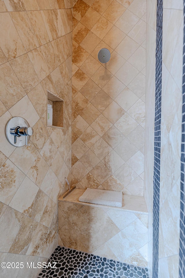 full bath with tiled shower