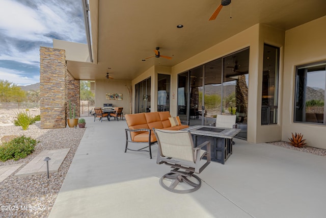 view of patio featuring outdoor dining area and ceiling fan