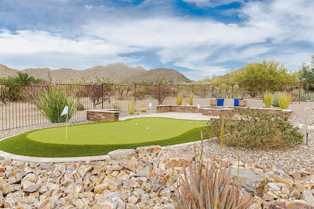 view of yard with a mountain view and a fenced backyard