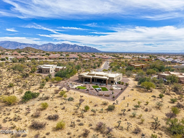 aerial view featuring a desert view and a mountain view