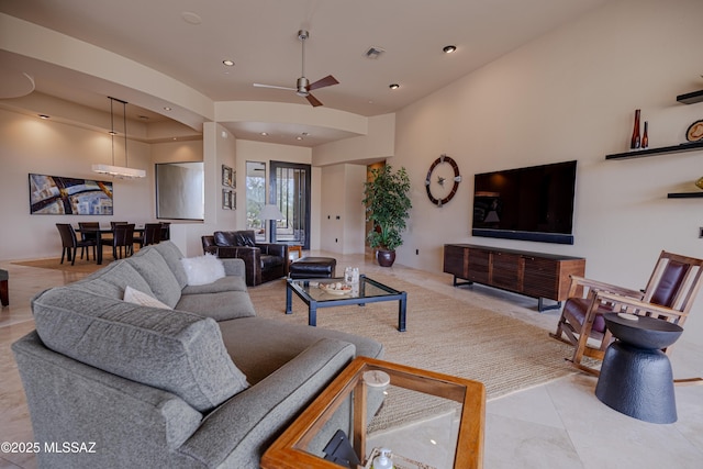 living area with recessed lighting, visible vents, and ceiling fan