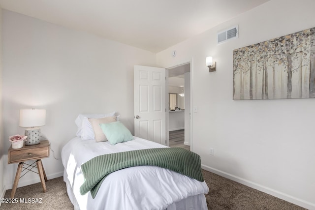 bedroom featuring carpet floors, visible vents, and baseboards