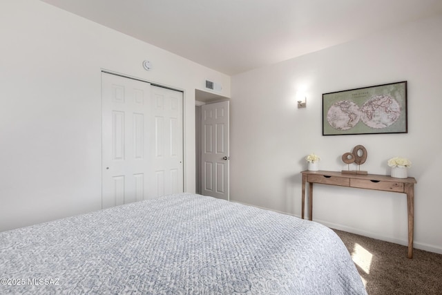 carpeted bedroom with a closet, visible vents, and baseboards