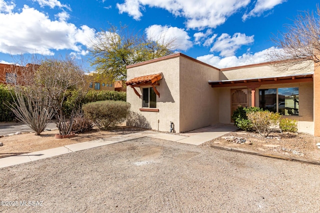 view of side of property with stucco siding