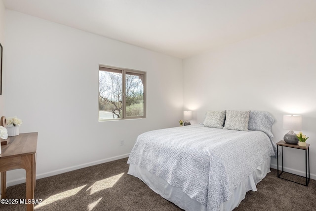 bedroom featuring carpet flooring and baseboards