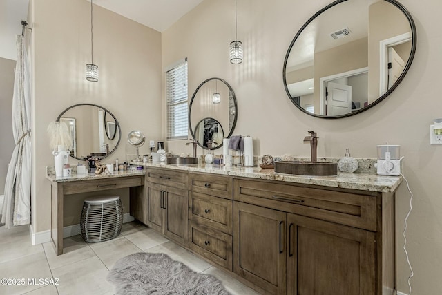 bathroom featuring double vanity, tile patterned flooring, and visible vents