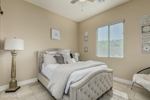 bedroom with baseboards, visible vents, a ceiling fan, and light tile patterned flooring