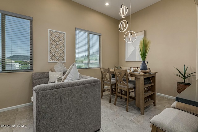 dining space with a healthy amount of sunlight, light tile patterned floors, baseboards, and recessed lighting