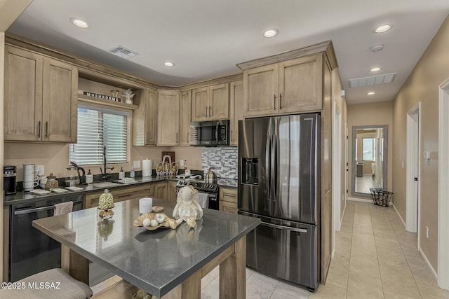 kitchen with stainless steel appliances, visible vents, a sink, and open shelves