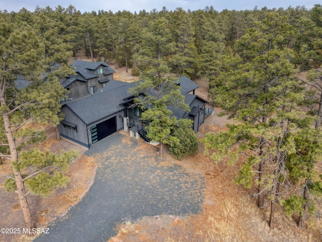 aerial view with a wooded view