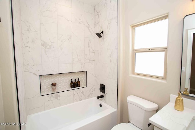 bathroom featuring toilet, shower / bath combination, and vanity