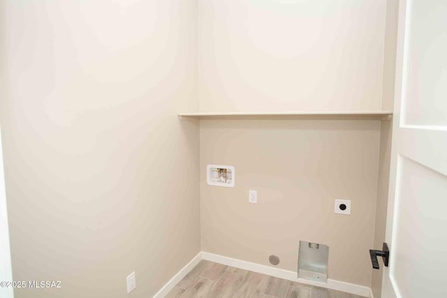 laundry room featuring laundry area, hookup for an electric dryer, washer hookup, light wood finished floors, and baseboards