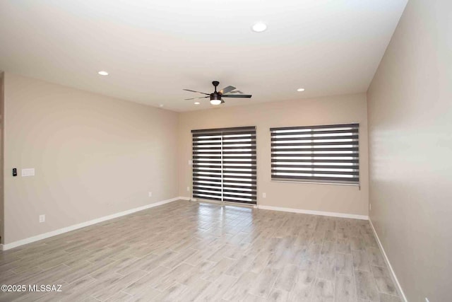 unfurnished room with ceiling fan, recessed lighting, light wood-style flooring, and baseboards