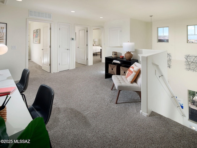 carpeted office with visible vents and recessed lighting