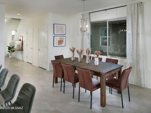 dining area featuring a notable chandelier