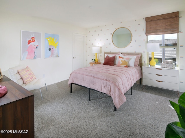 bedroom with carpet and wallpapered walls