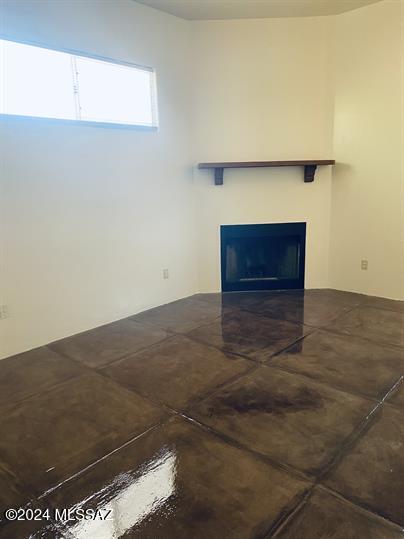 unfurnished living room with a fireplace