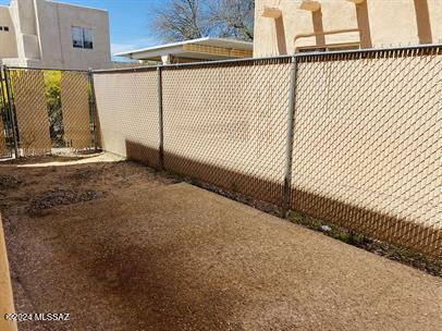 view of gate featuring fence