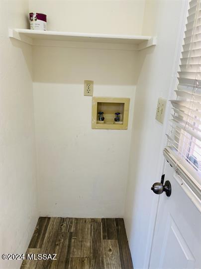 laundry area featuring laundry area, washer hookup, and dark wood-style flooring