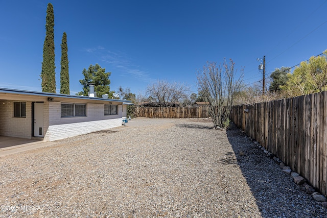 view of yard featuring a fenced backyard