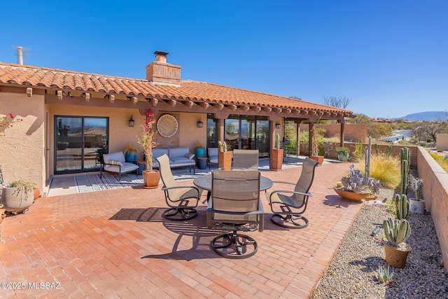 view of patio / terrace featuring a mountain view and fence