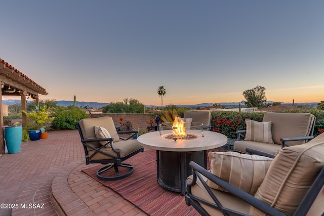 view of patio / terrace featuring an outdoor living space with a fire pit