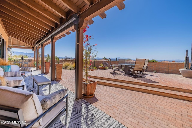 view of patio with outdoor dining space, outdoor lounge area, and a fenced backyard