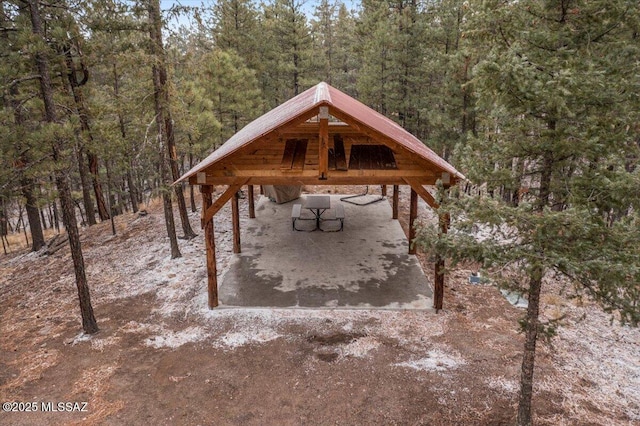 view of home's community with a forest view and a gazebo