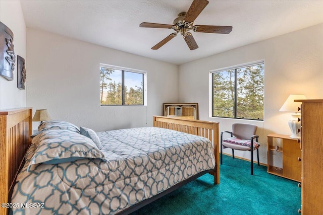 carpeted bedroom featuring ceiling fan